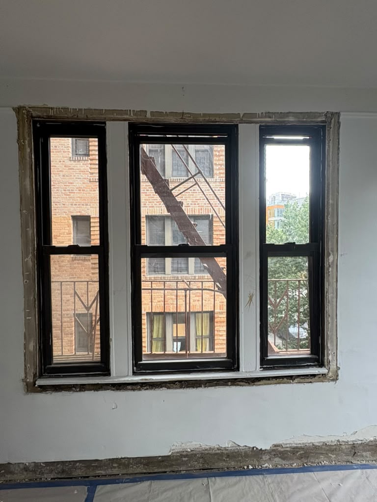 Three apartment window components prepared during an abatement project