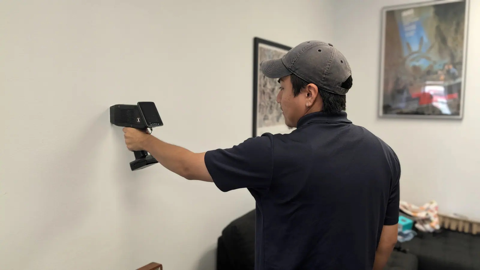 Manhattan Lead inspector taking an XRF reading on an interior apartment wall