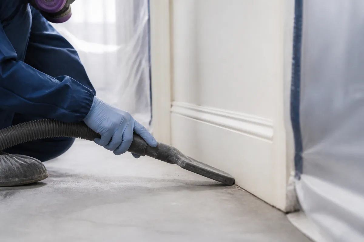 HEPA vacuuming of floors and edges in a controlled work area