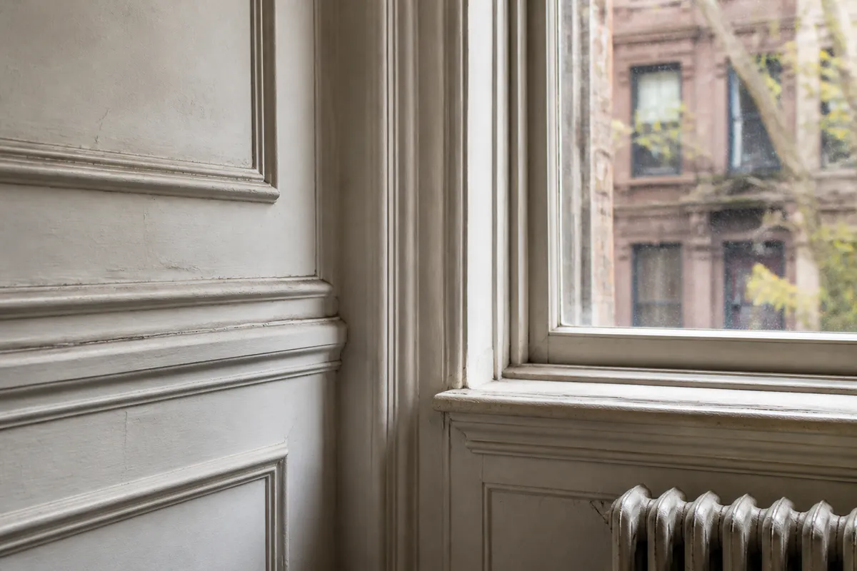Historic painted trim and window inside an older New York City apartment